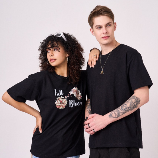 Unisex black color 100% Cotton drop shoulder graphic TShirt. Premium heavy fabric drapes very well over your frame & is a great choice for evening wear.