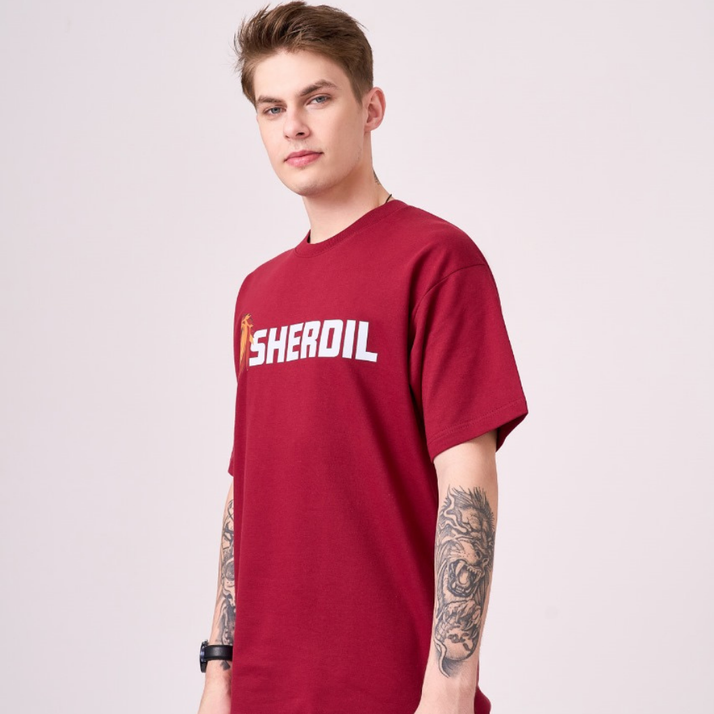 Unisex maroon color 100% Cotton drop shoulder graphic TShirt. Premium heavy fabric drapes very well over your frame & is a great choice for evening wear.